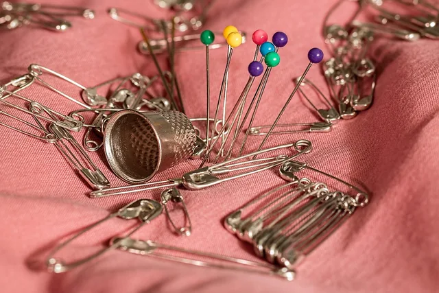 sewing, thimble, pins, safety pins, needle, mending, repair, haberdashery, prick, sewing, sewing, sewing, sewing, sewing, pins, needle. Garment durability and care checklist for product teams