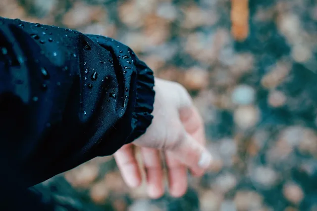 people, hands, nature, jacket, water, droplets. PFC-Free Waterproof Coatings on Bio-Based Jackets: How to Test