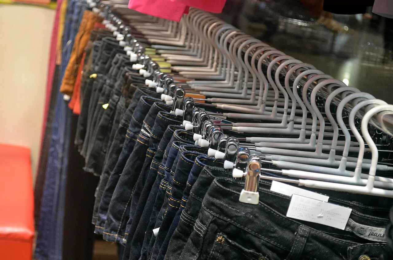 Jeans arranged on a clothing rack